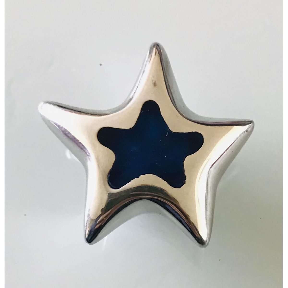 Bouton étoile argenté coeur bleu